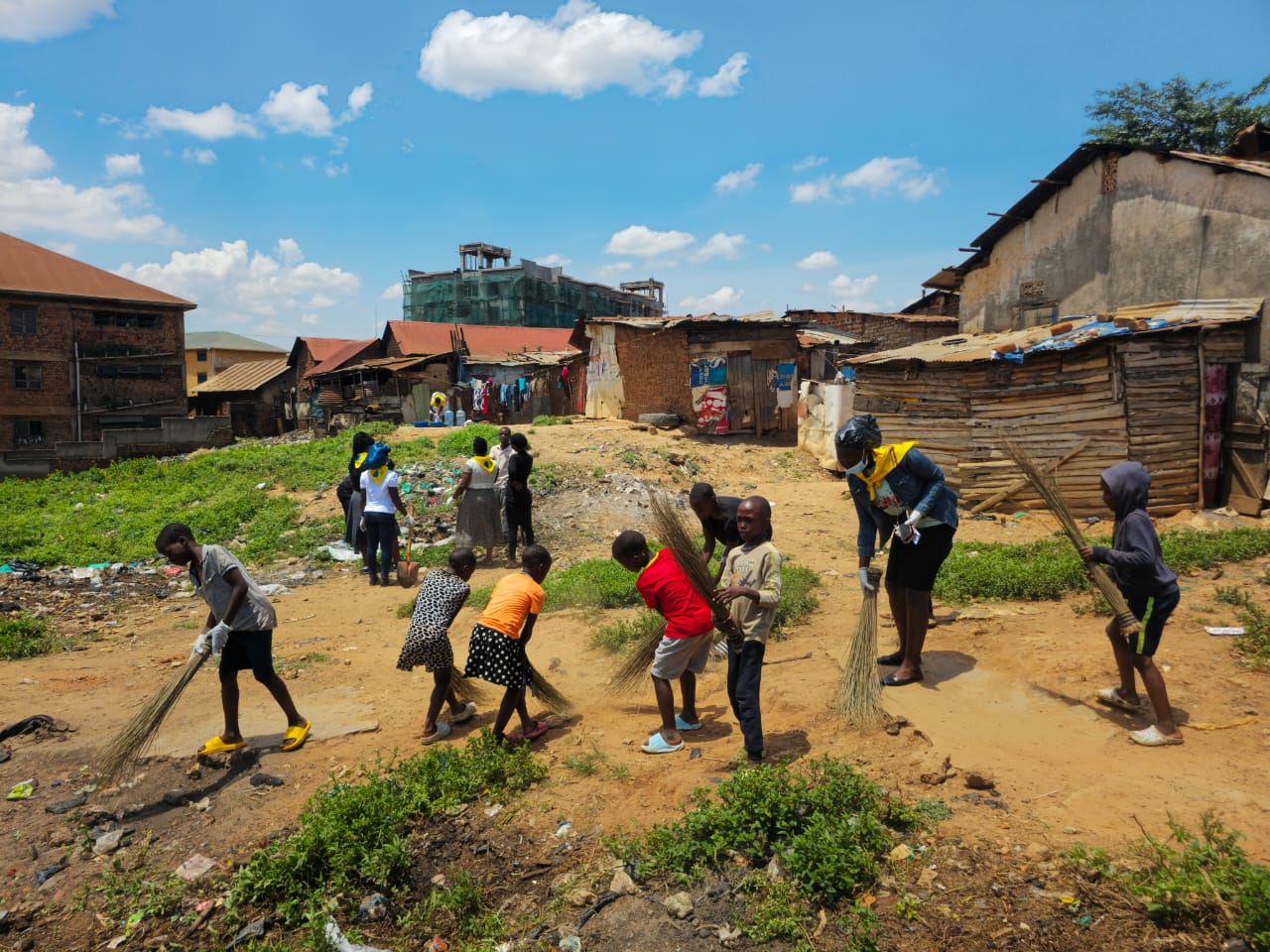 Children sweeping the streets of Kivulu